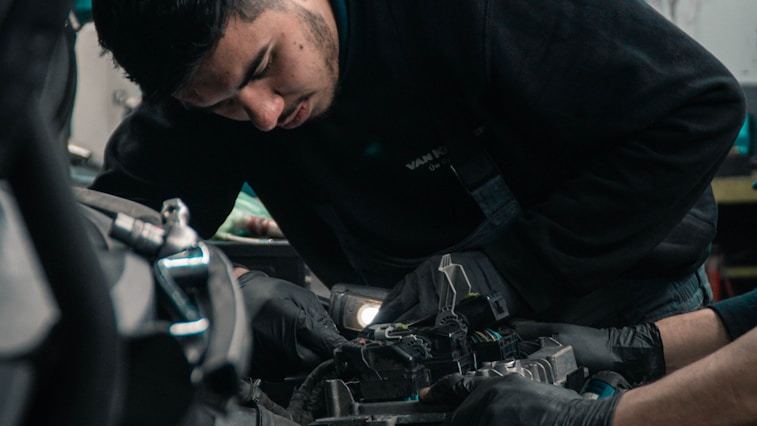Latin American auto workshop with engine components