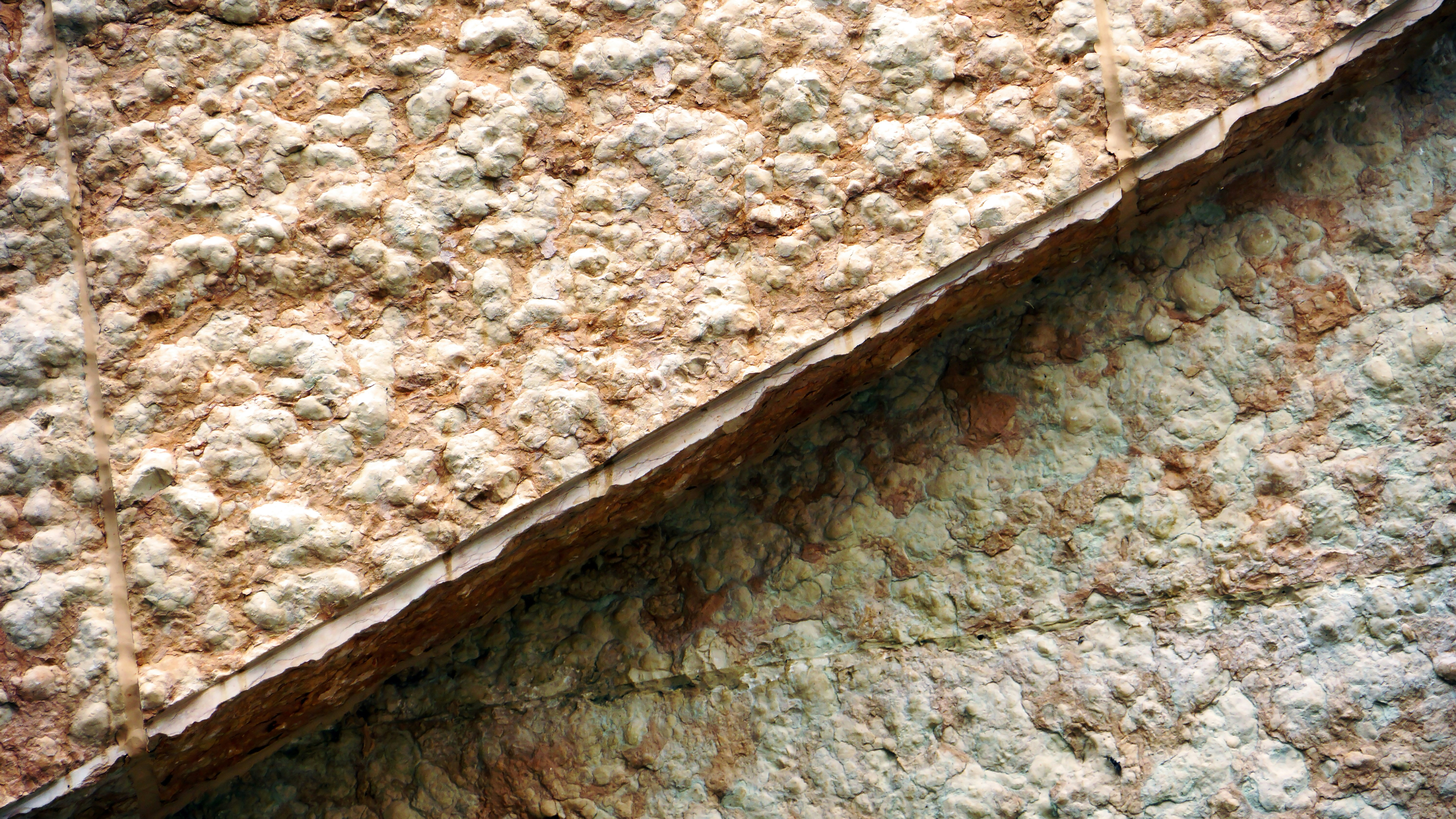 A close-up view of a sintered stone slab, highlighting its texture and seamless surface.