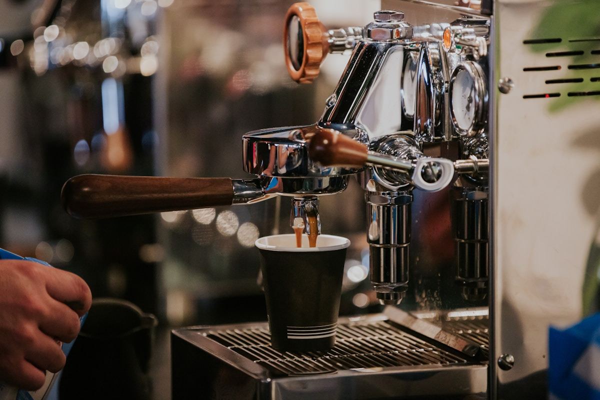 Black and silver coffee machine suitable for UAE distribution channels