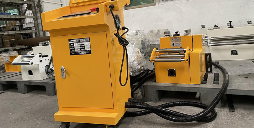 Engineer inspecting coil feeding machinery