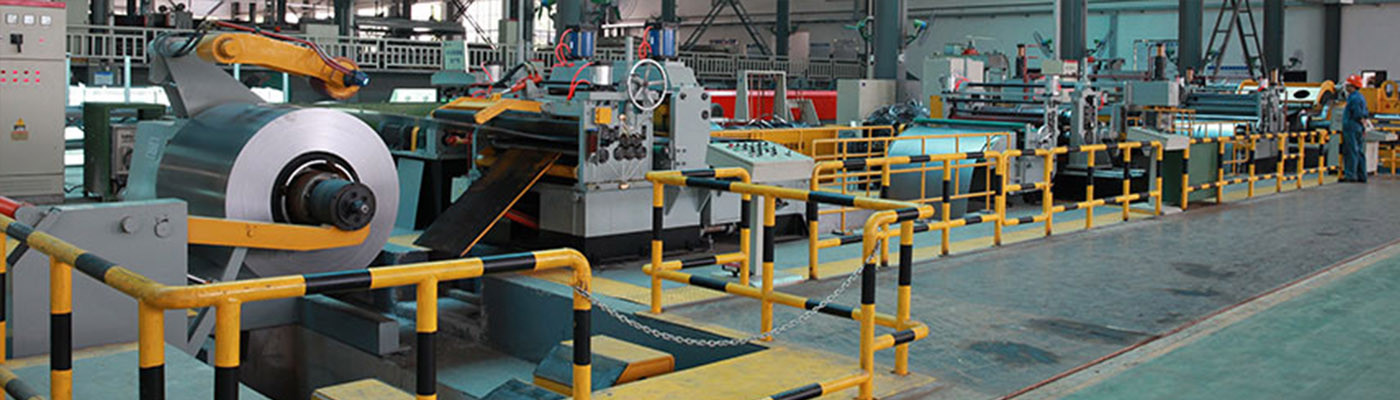 Industrial decoiler machine feeding steel coil into automated production line