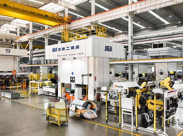 High-speed automatic decoiler feeding steel coil into servo press line