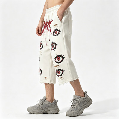 DTG Print Evil Eye Vintage Abrade Cropped Pants | Distressed Ripped Cut-Off Capri Pants | OEM Streetwear
