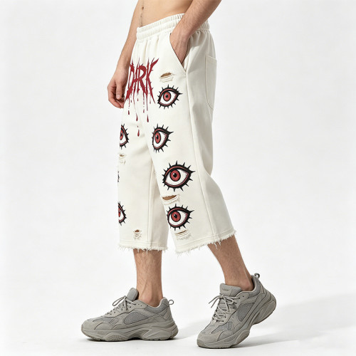 DTG Print Evil Eye Vintage Abrade Cropped Pants | Distressed Ripped Cut-Off Capri Pants | OEM Streetwear