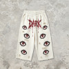 DTG Print Evil Eye Vintage Abrade Cropped Pants | Distressed Ripped Cut-Off Capri Pants | OEM Streetwear