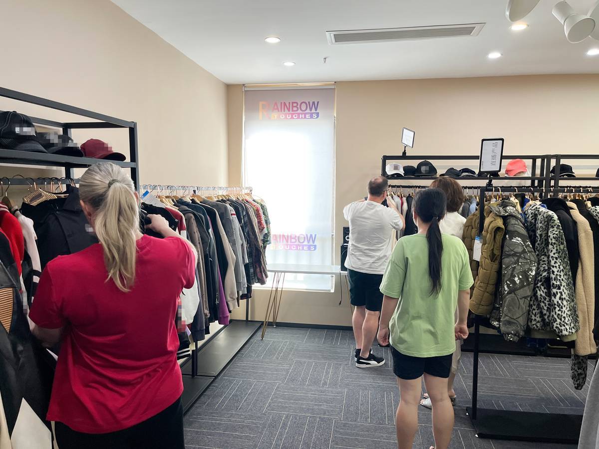 Touches Dark garment samples displayed during customer factory visit