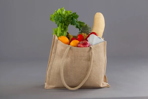 Cotton and linen reusable bags, durable and eco-friendly with reduced carbon footprint through repeated use.