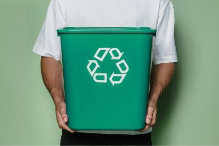 Recyclable bag with a recycling symbol, representing energy-intensive and inefficient recycling processes.