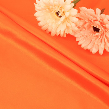 Pioneering Sustainable Fashion with RPET Satin Transforming Recycled Plastic Bottles into Luxurious Eco-Friendly Garments