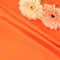 Pioneering Sustainable Fashion with RPET Satin Transforming Recycled Plastic Bottles into Luxurious Eco-Friendly Garments