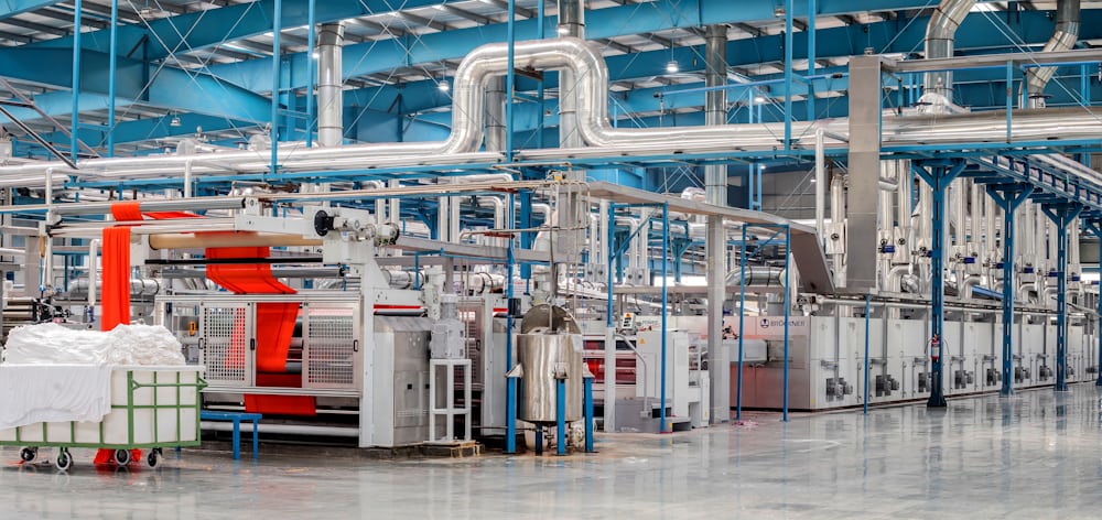 Woven fabric production on loom machinery