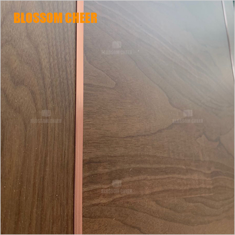 The decorative strip of the wood veneer door