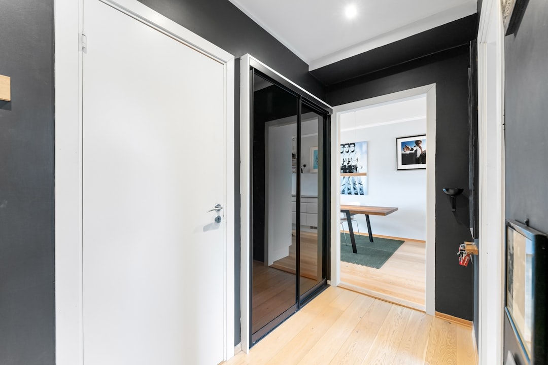 A stylish home with modern black pivot panel doors