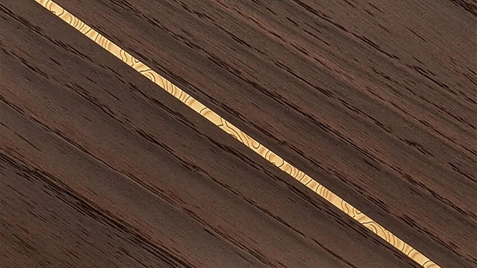 Micro-inlaid metal trim on aluminum-wood door