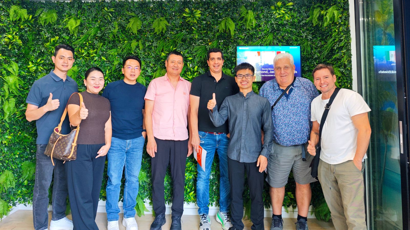 BLOSSOM CHEER team with visiting clients at the Panyu office, Guangzhou, October 2026