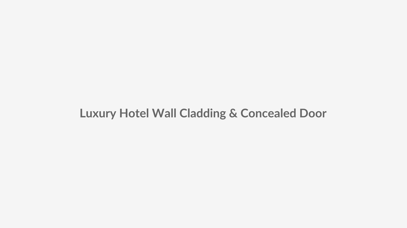 Real-life architectural photo placeholder showing bespoke timber wall cladding integrated with a concealed flush door in a luxury hotel lobby