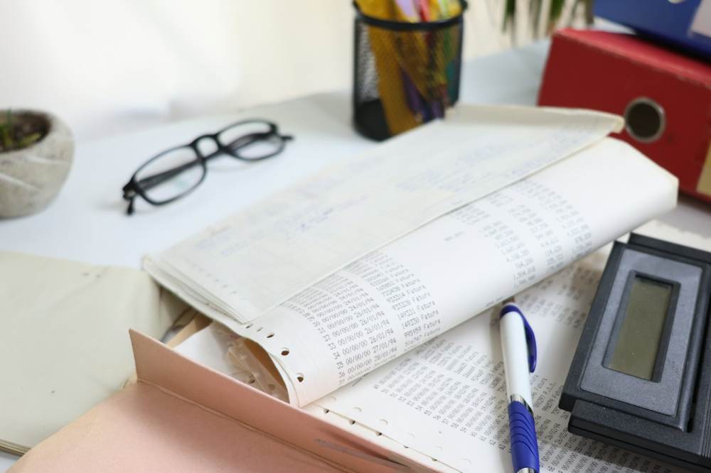 Paperwork and a calculator on an office desk