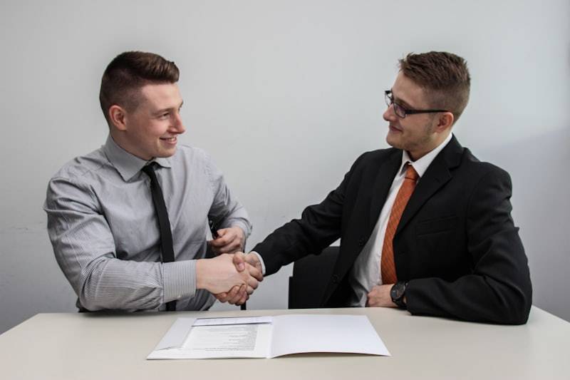 Business partnership handshake