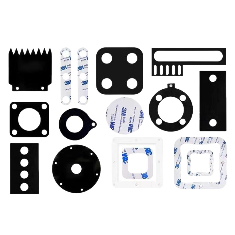 Molded silicone gaskets of various shapes with 3M 9448A release paper visible on the backing