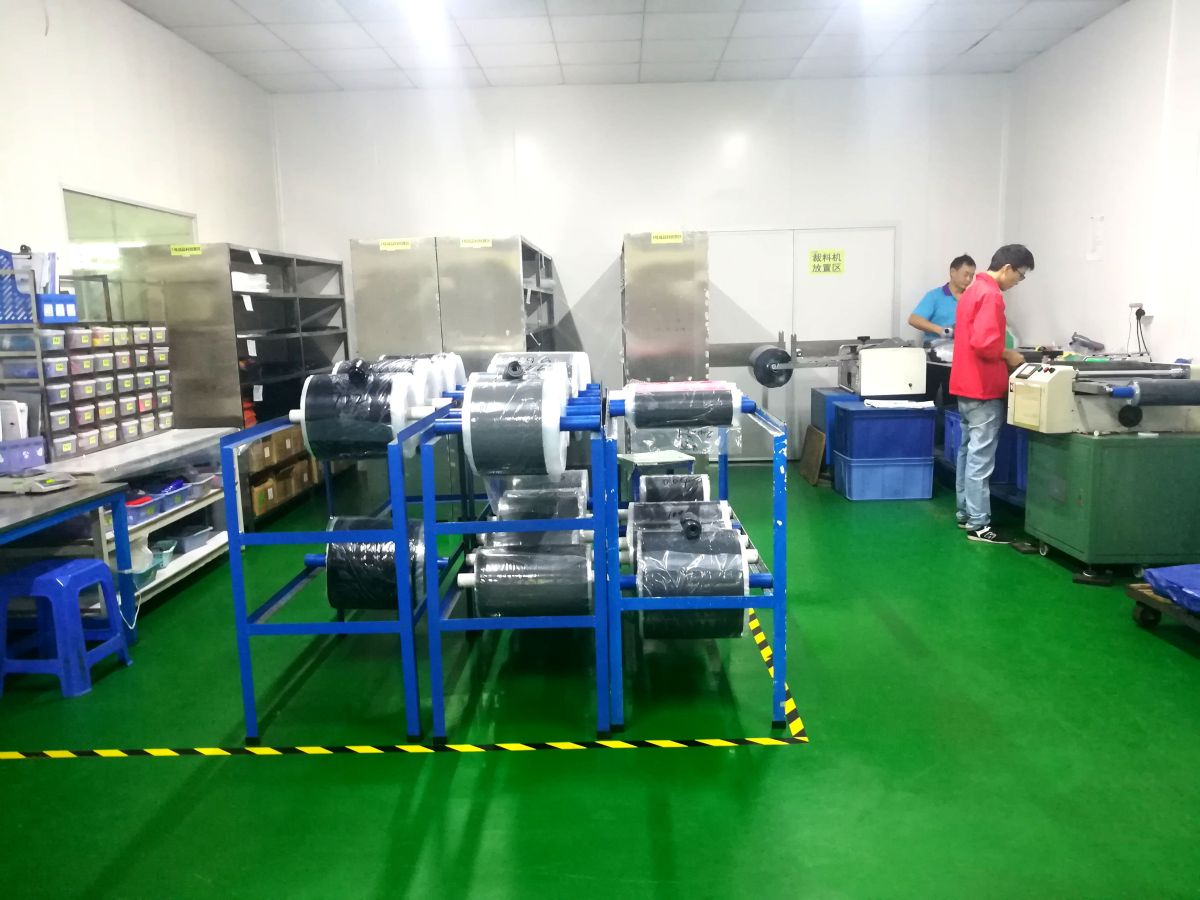 FromRubber silicone workshop with compound rolls, cutting machine and material racks