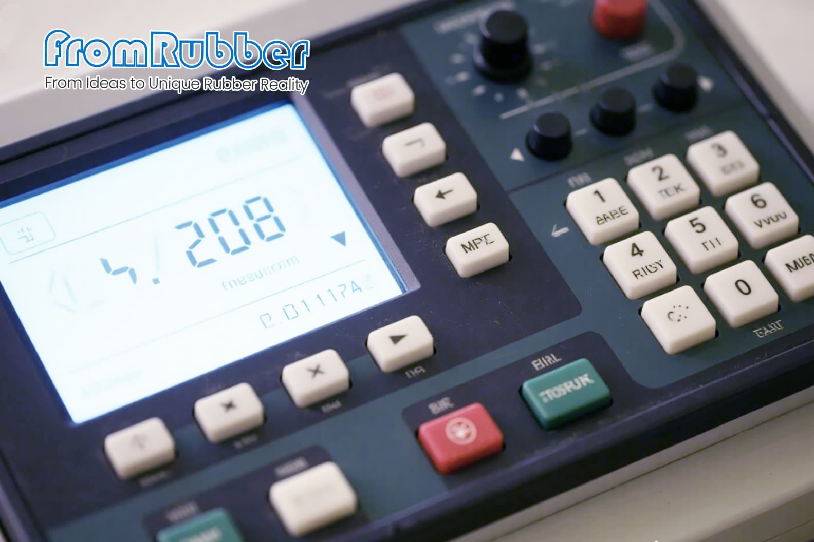 A Pantone color guide next to several silicone keypad samples in different colors