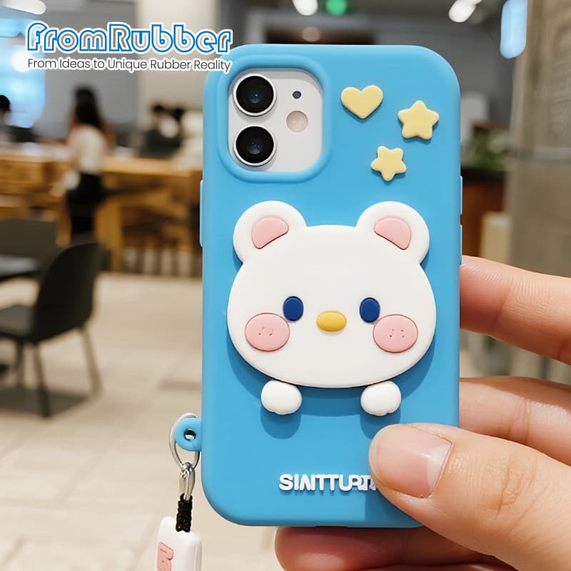 Custom multi-color silicone phone case with a raised 3D cartoon bear design, held in hand