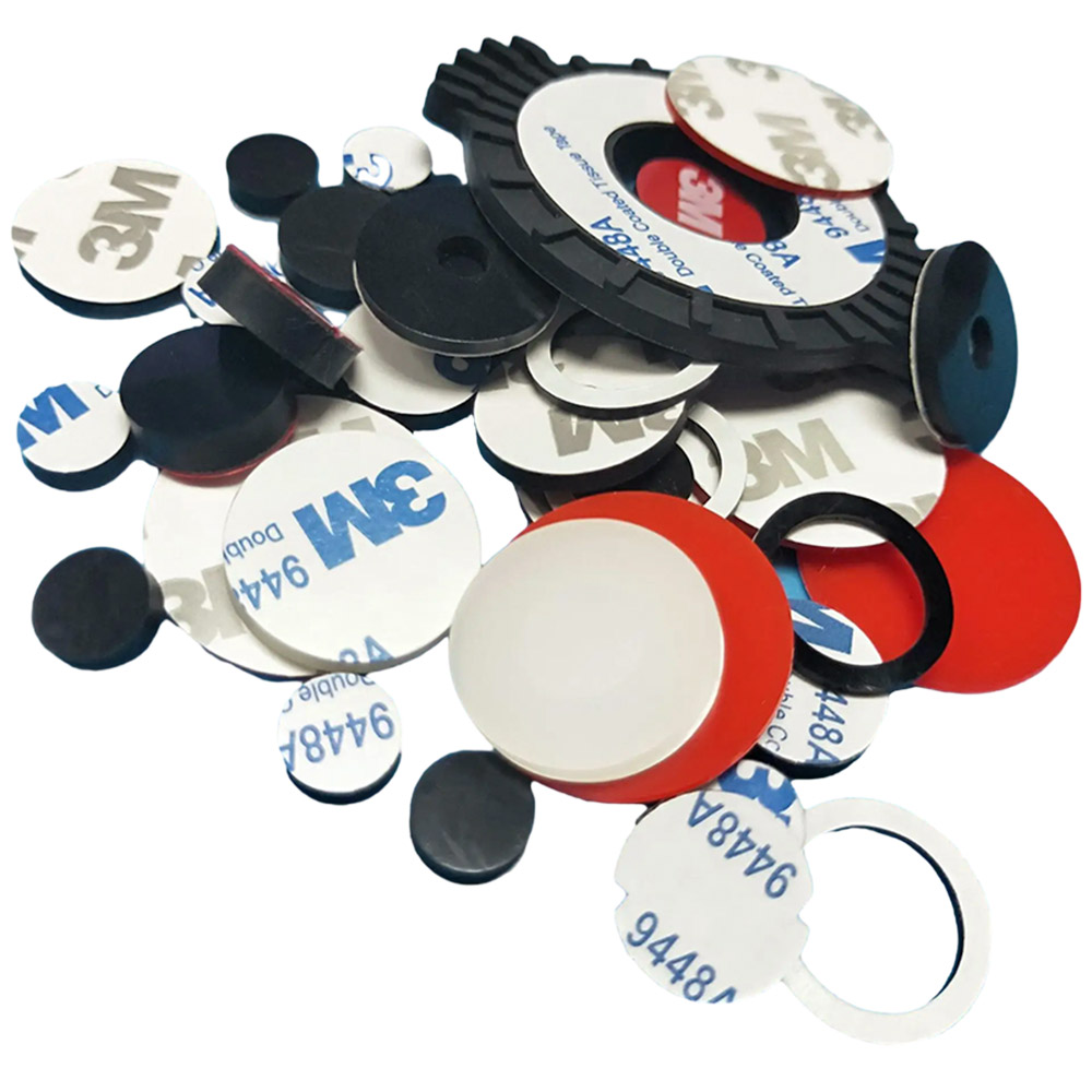 Die-cut silicone pads with 3M adhesive backing on a production bench