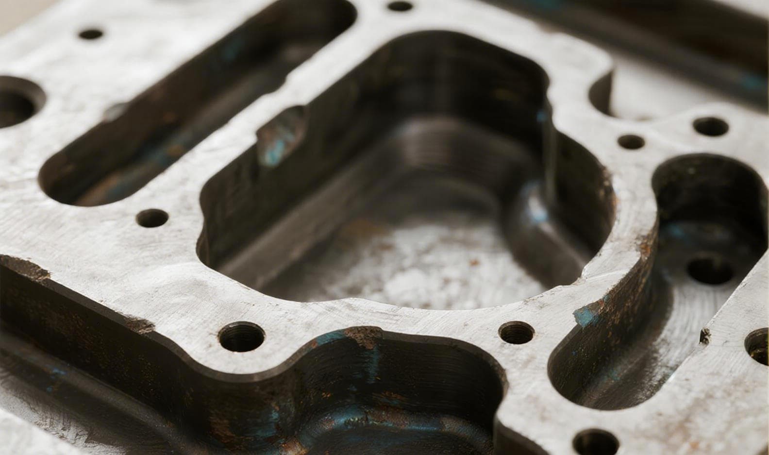 S136H mold cavity surface after 50,000 production cycles showing minimal wear