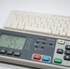 What surface treatments are available for a silicone keypad to extend its life in aggressive industrial environments?