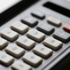What is the typical shrinkage rate of a molded silicone keypad, and how should I account for it in panel design?