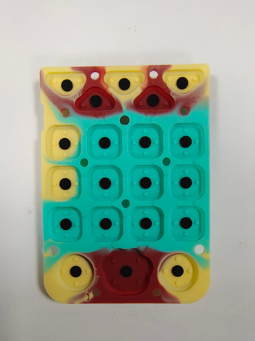Multi-color custom silicone rubber keypad with integrated conductive carbon contact pills