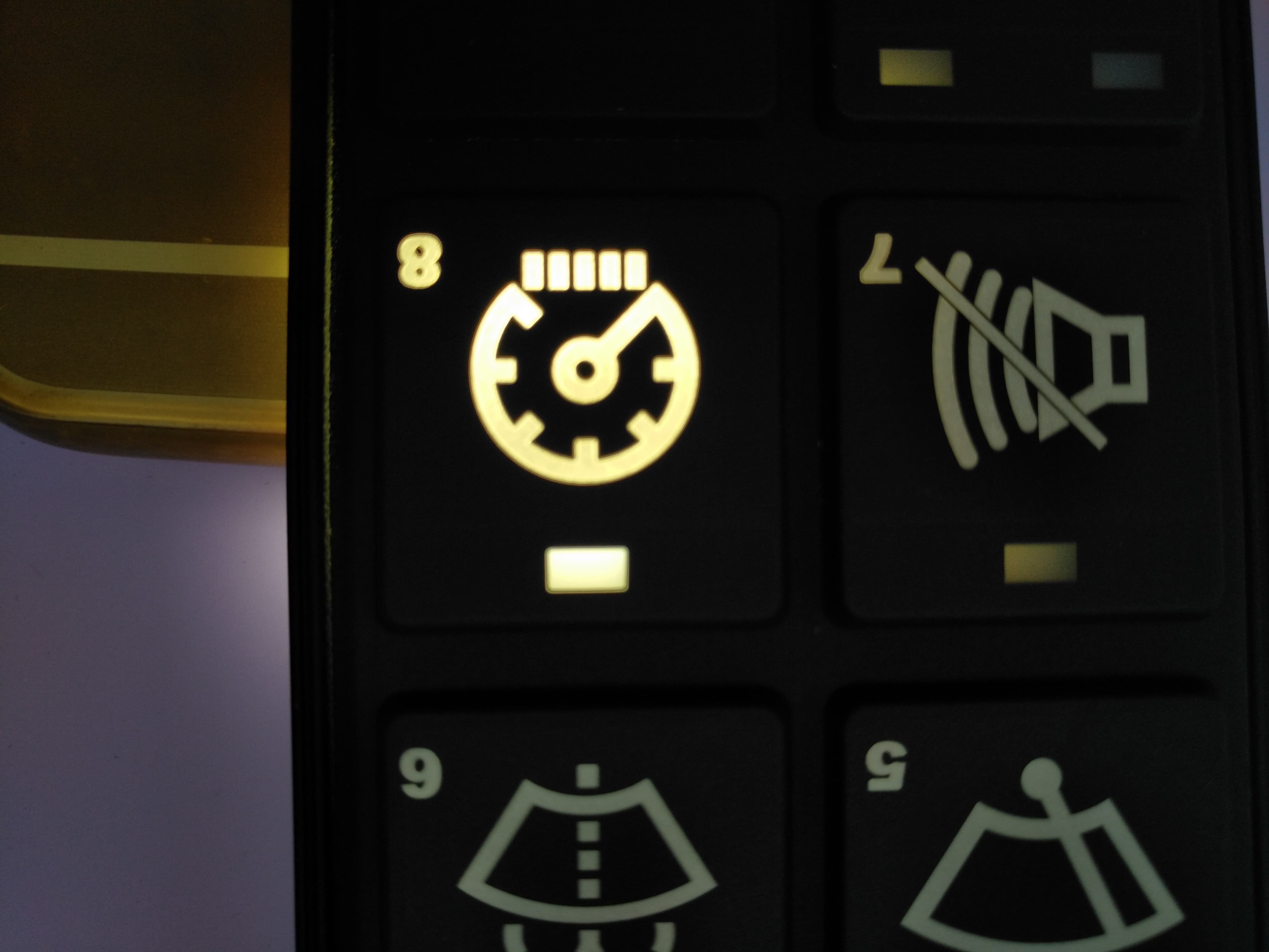 backlit silicone keypad with laser-etched icons on dark surface for industrial control panel