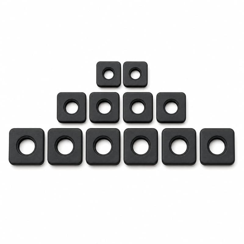 Square profile rubber grommets in several sizes arranged in rows for thin sheet metal panel openings