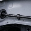 How Does a Rubber Grommet Fit Around an Automotive Wire Harness?