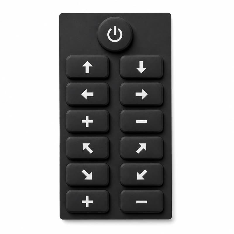 Vertical silicone control overlay for heavy machine panels with a round power button above twelve arrow, plus and minus keys and diagonal direction keys