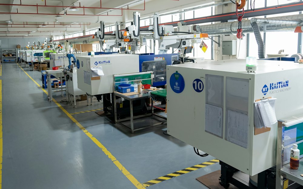 Compression molding workshop filled with silicone molding machines