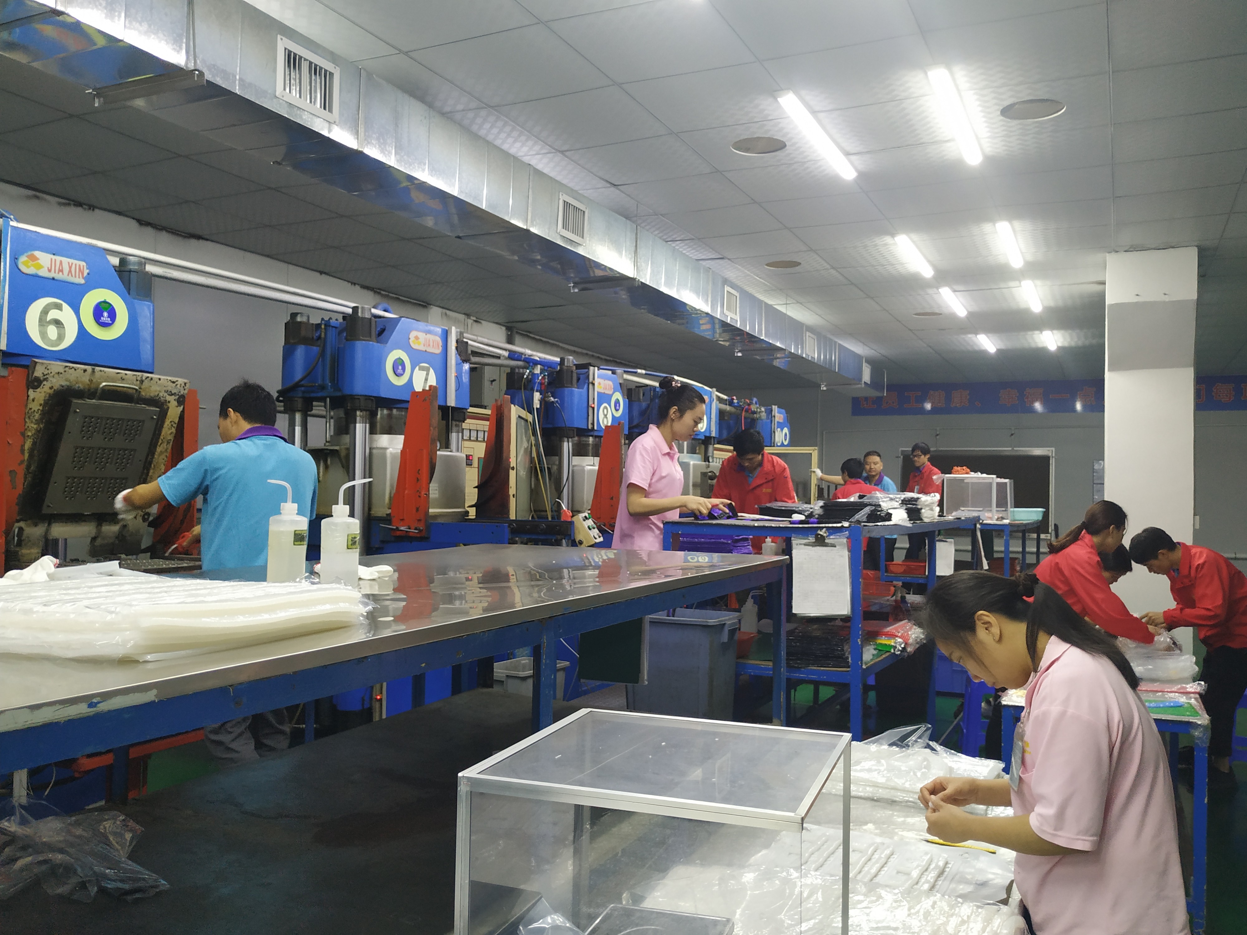Industrial workshop floor with precision manufacturing machinery and marked walkways