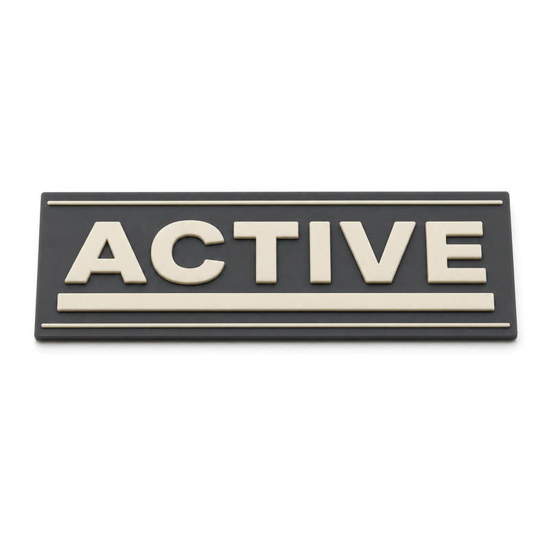 Moulded silicone clothing patch with contrast letters and thick and thin rules showing narrow gaps between elements