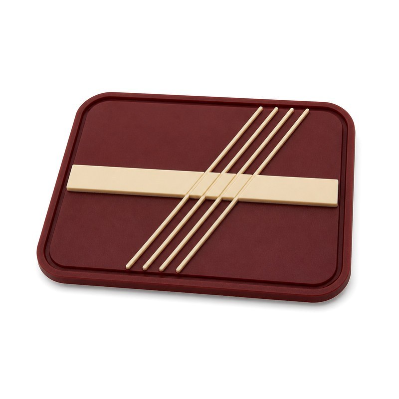 Hairline silicone lines crossing a bold bar on a custom silicone logo patch for clothing, illustrating minimum line and gap spacing in moulded silicone