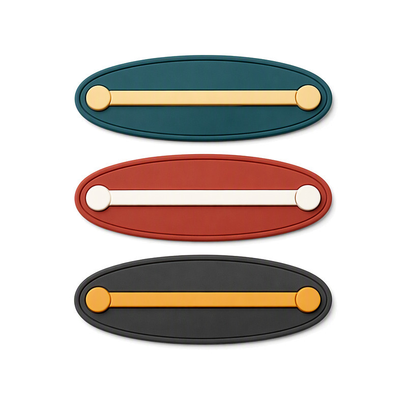 Oval moulded silicone patches with a raised bar and enlarged rounded ends showing relief height