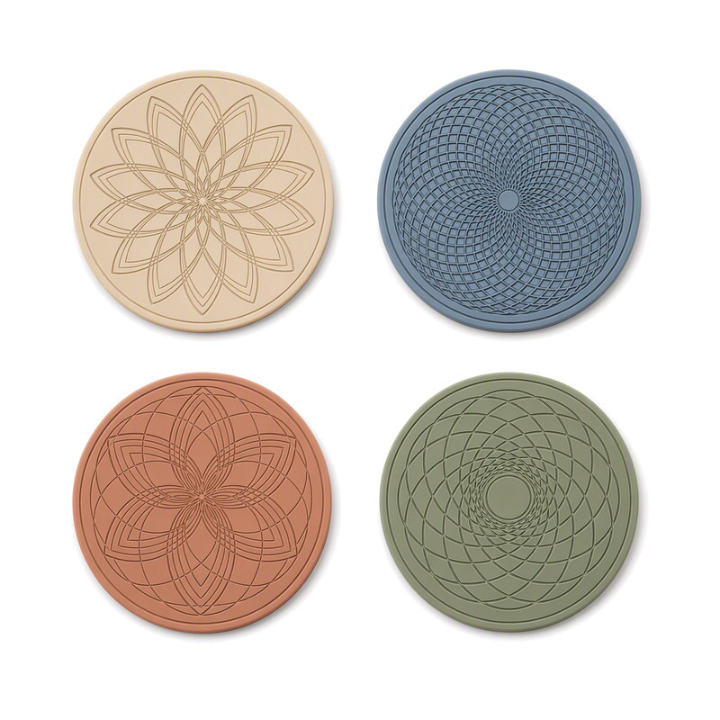 Moulded silicone patches with engraved line rosettes showing engraved versus raised relief detail