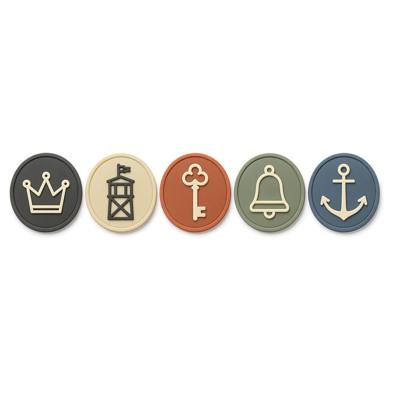 Round moulded silicone headwear patches with raised crown anchor bell and key emblems