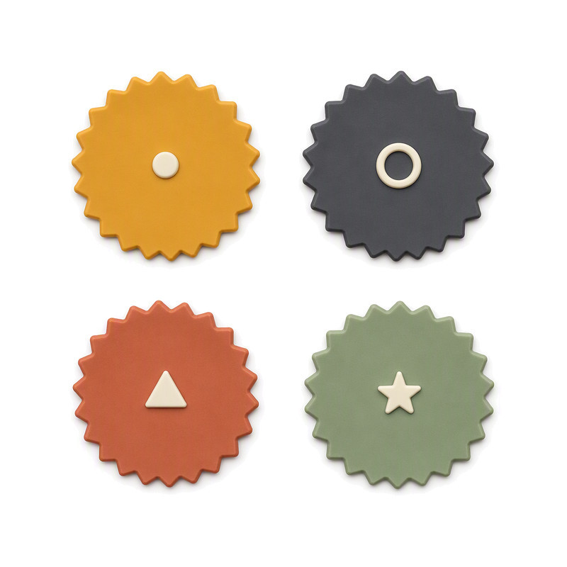 Scalloped-edge moulded silicone labels with raised centre emblems for bag and luggage detailing