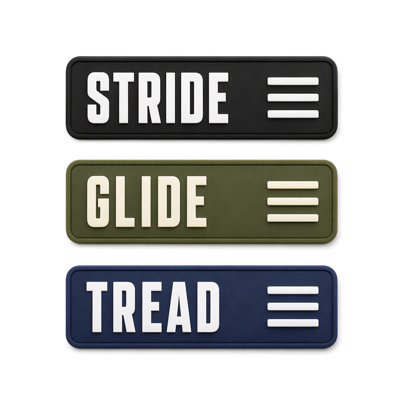 Three moulded silicone footwear labels for shoe tongues in black, olive and navy with raised word marks and a compact bar symbol