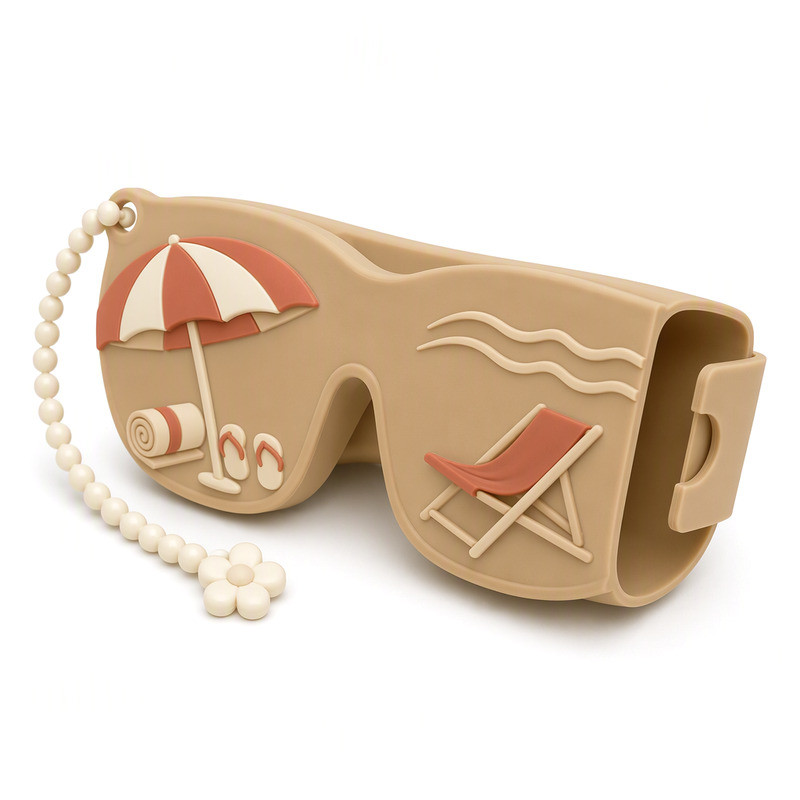 Silicone sunglasses case in sand colour with a moulded beach parasol motif and cream retaining bands