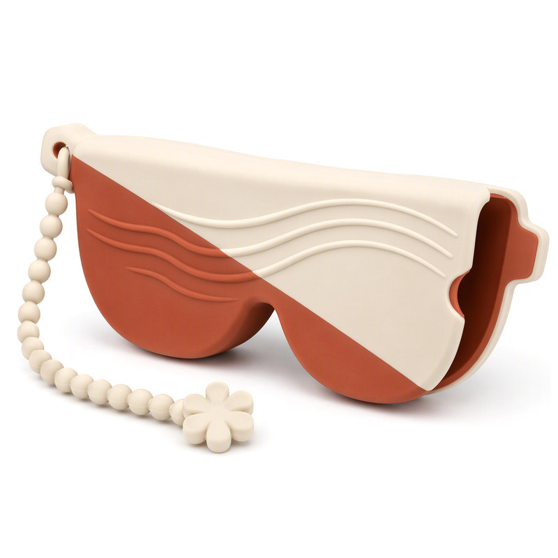 Slim silicone sunglasses sleeve with diagonal wave relief and beaded strap, shown edge-on to reveal wall thickness