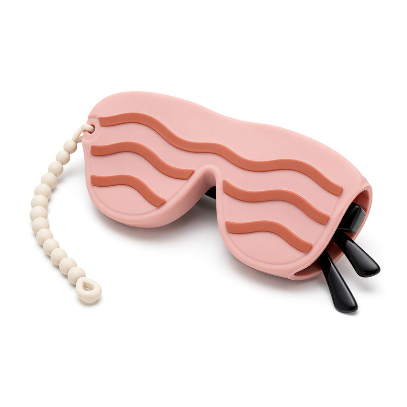 Blush pink silicone sunglasses sleeve with coral wave relief and a pale beaded strap