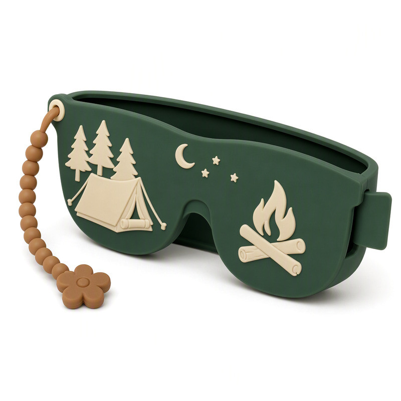 Forest green silicone sunglasses case with a moulded camping scene and cream strap