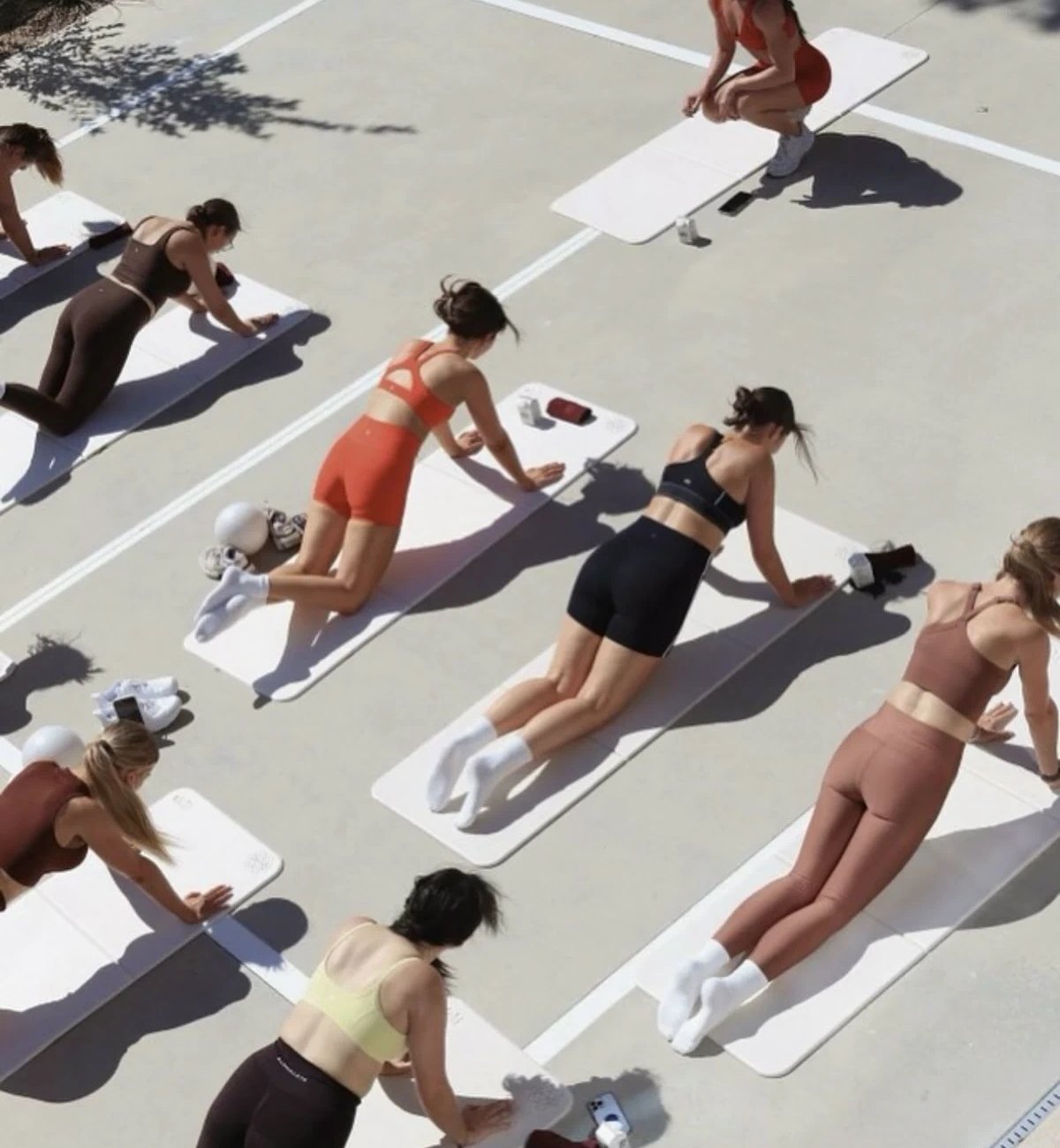 Outdoor group activewear session in coordinated colorways from a single manufacturer program