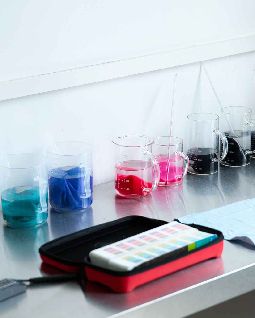 Athletic wear fabric colorfastness testing at the Eationwear dye lab: bulk lots checked against standards before cutting